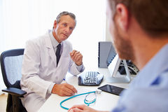 male-patient-having-consultation-doctor-office-59930870.jpg