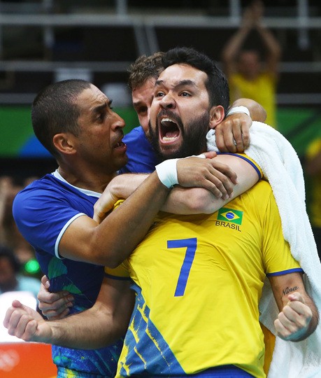 BrazilsLiberoSrgioDutraandBrunoRezendehugteammateWilliamArjonaafterwinningthemat.jpg